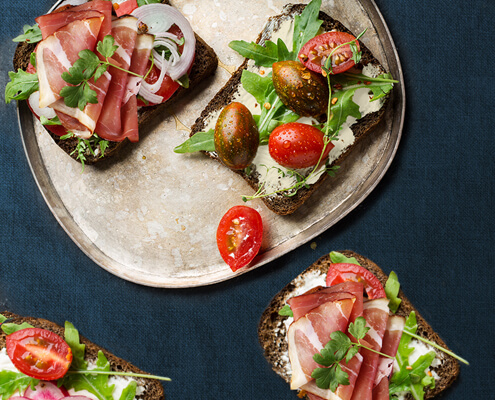 Goat cheese, prosciutto and artichoke hearts open-faced sandwich