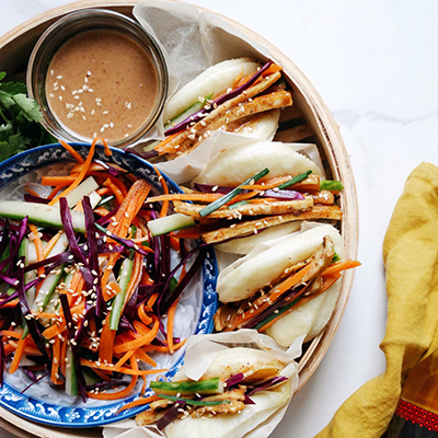 Vegan tofu Bao buns with marinated vegetables and creamy almond sauce