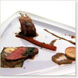 Root-Vegetable-Stuffed Rack of Lamb with Olive-Parmesan Biscuits, Eggplant Caviar and Lamb Jus