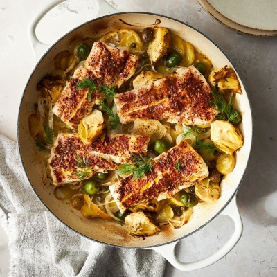 Fish casserole with spices, potatoes and artichokes