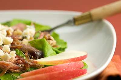 Confit de canard en salade tiède