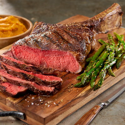 Tomahawk beef rib, curry sweet potato purée, lemon grilled asparagus