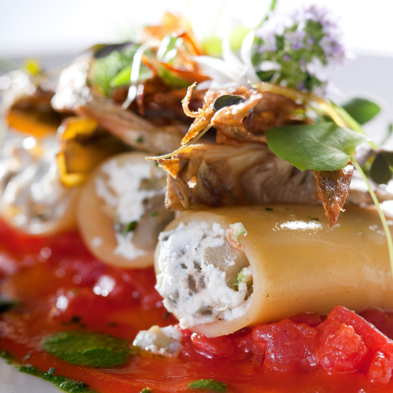 Paccheri with saffron from Enna, filled with ricotta cheese, violet artichokes and tomatoes with aromatic herbs