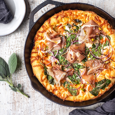 Prosciutto and Spinach Deep Dish Skillet Pizza with a Roasted Squash Sauce and Pistachio Chili Oil