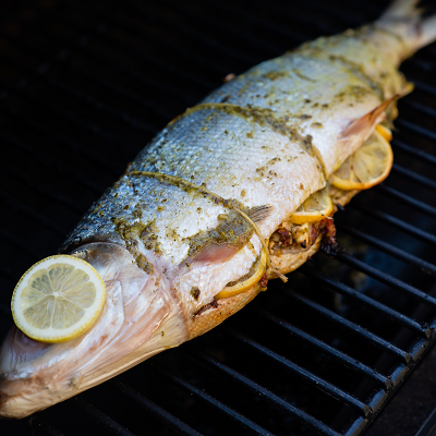 Grilled Whole Stuffed Fish with Sundried Tomatoes, Feta, and Herb Butter