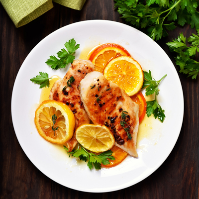 Chicken with orange marmelade, grapefruit and lemon Dora