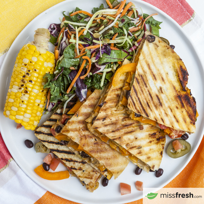 Vegetarian Quésadillas with Grilled Corn and Slaw Garnished with Pumpkin Seeds