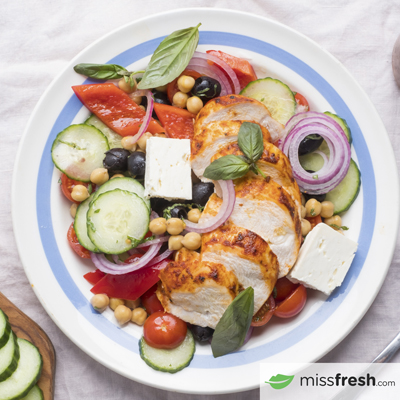 Chickpea Greek Salad garnished with Roasted Chicken