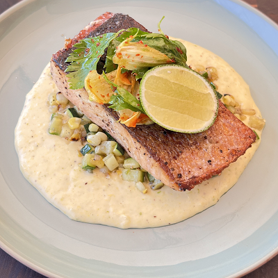 Unilateral salmon with corn puree and pan-fried zucchini and corn