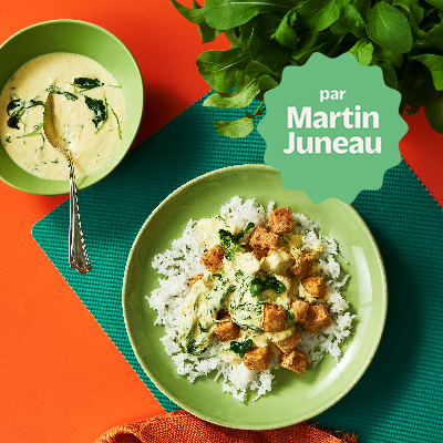 Crispy curry tofu with braised arugula on basmati rice